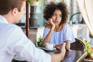 Woman disinterested on blind date
