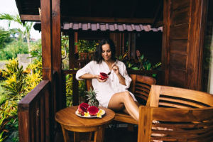 Woman in tropical location wearing cotton nightie