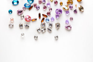 assorted colorful gemstones on white background