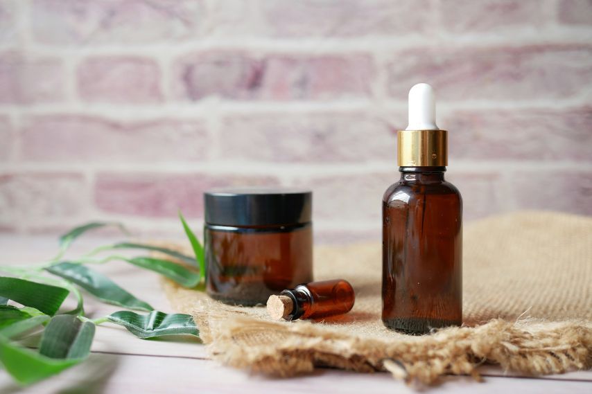 natural beauty products in brown glass bottles