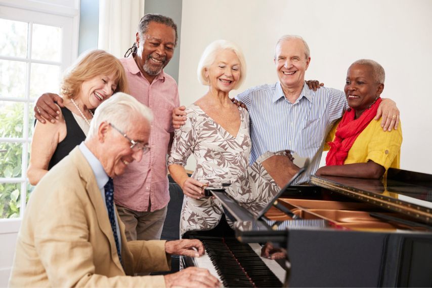 group of seniors by piano