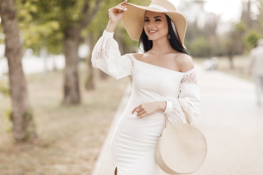 woman wearing white dress and hat