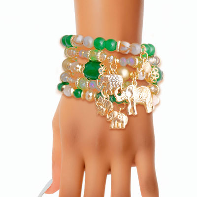 Green Bead 5 Stack Elephant Bracelets Stretchable on Womans Hand